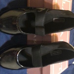 Black patent leather Laura Scott slip on flats.
